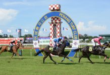 Penang Turf Club racing action.