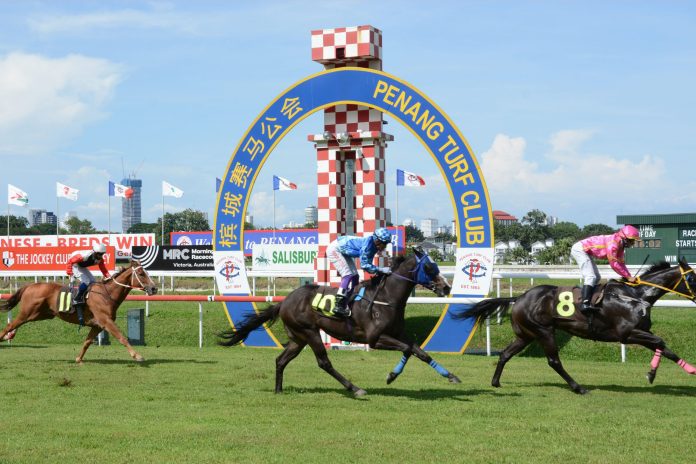 Penang Turf Club racing action.