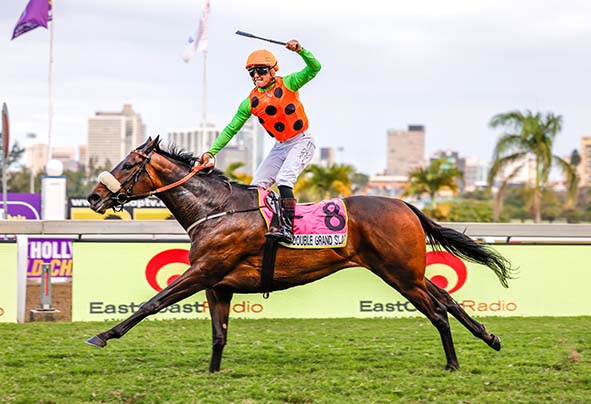 Richard Fourie scores his 335th win aboard the Justin Snaith-trained DOUBLE GRAND SLAM in the Grade 2 East Coast Radio Tibouchina Stakes at Hollywoodbets Greyville on Saturday. Picture: Candiese Lenferna